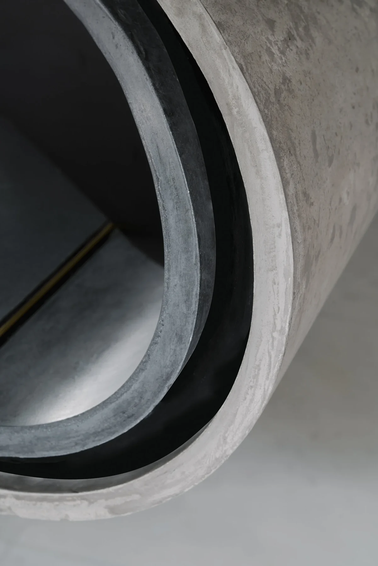 Detail of TSURI's handcrafted cast-concrete kitchen island at Harlyn Road